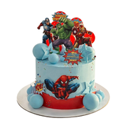 Blue and red birthday cake with Marvel superhero toppers, blue chocolate spheres, and stars. Dessert Boutique.