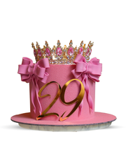 Round monochromatic pink celebration cake featuring retro Lambeth style ruffles, sugar pearls, and a silver crown by Dessert Boutique.