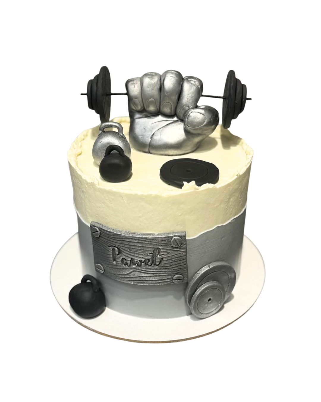 Gym themed cake decorated with a large metallic silver fist holding a barbell, kettlebells, and weight plates, personalized Pawel by Dessert Boutique