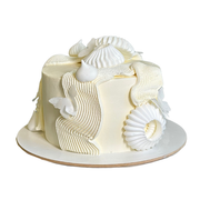 Cake with textured wave piping and white butterfly accents.