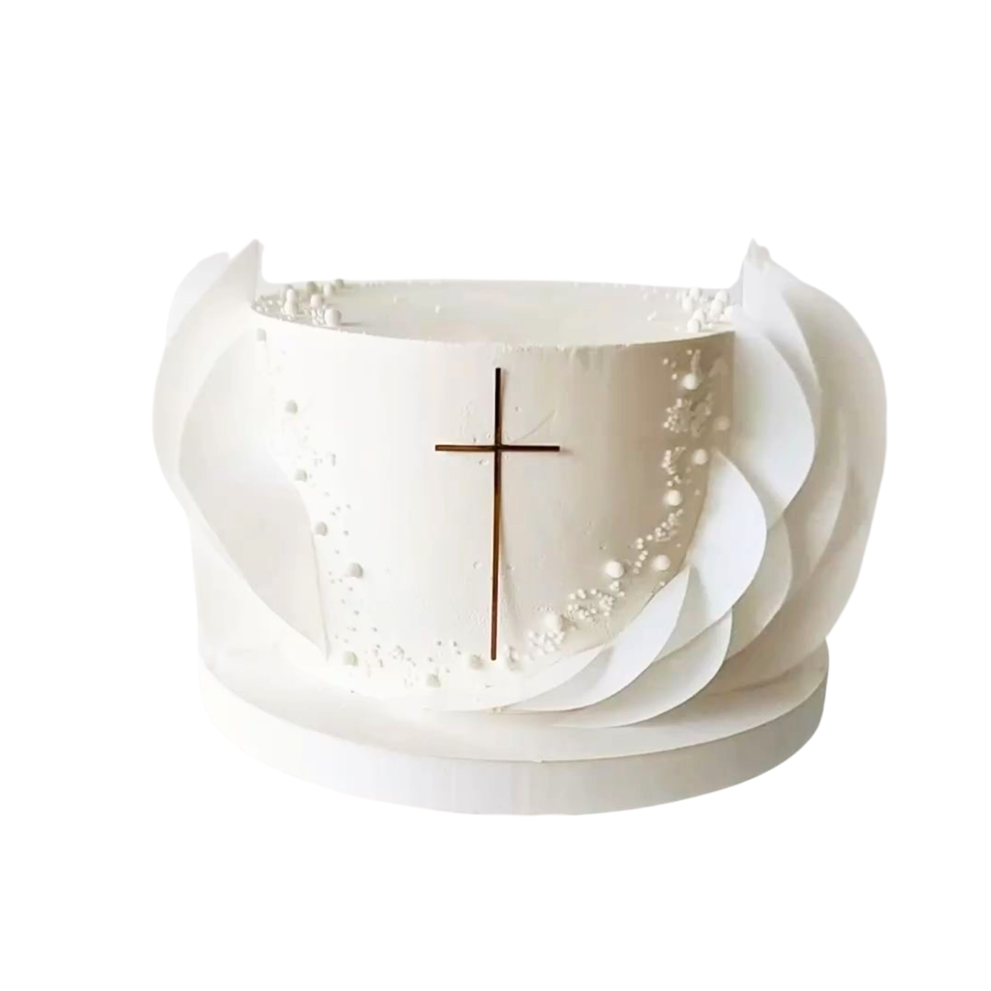 Tall white cake decorated with a thin gold cross topper and large white edible wafer petals on the sides. 
