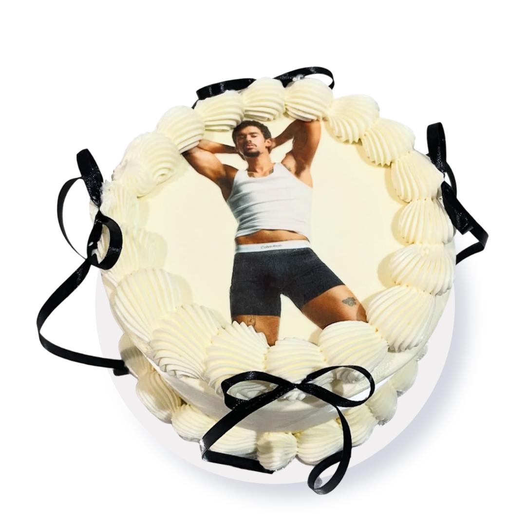 Square celebration cake with a central edible sugar photo sheet print and structured white buttercream border accents by Dessert Boutique.