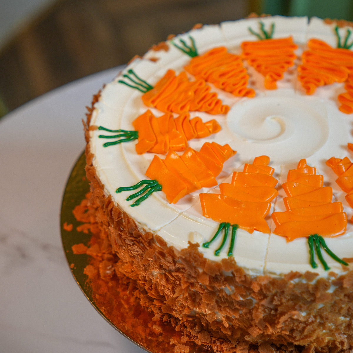 Close-up view of the fine piping and artisan texture of our signature handcrafted carrot cake.